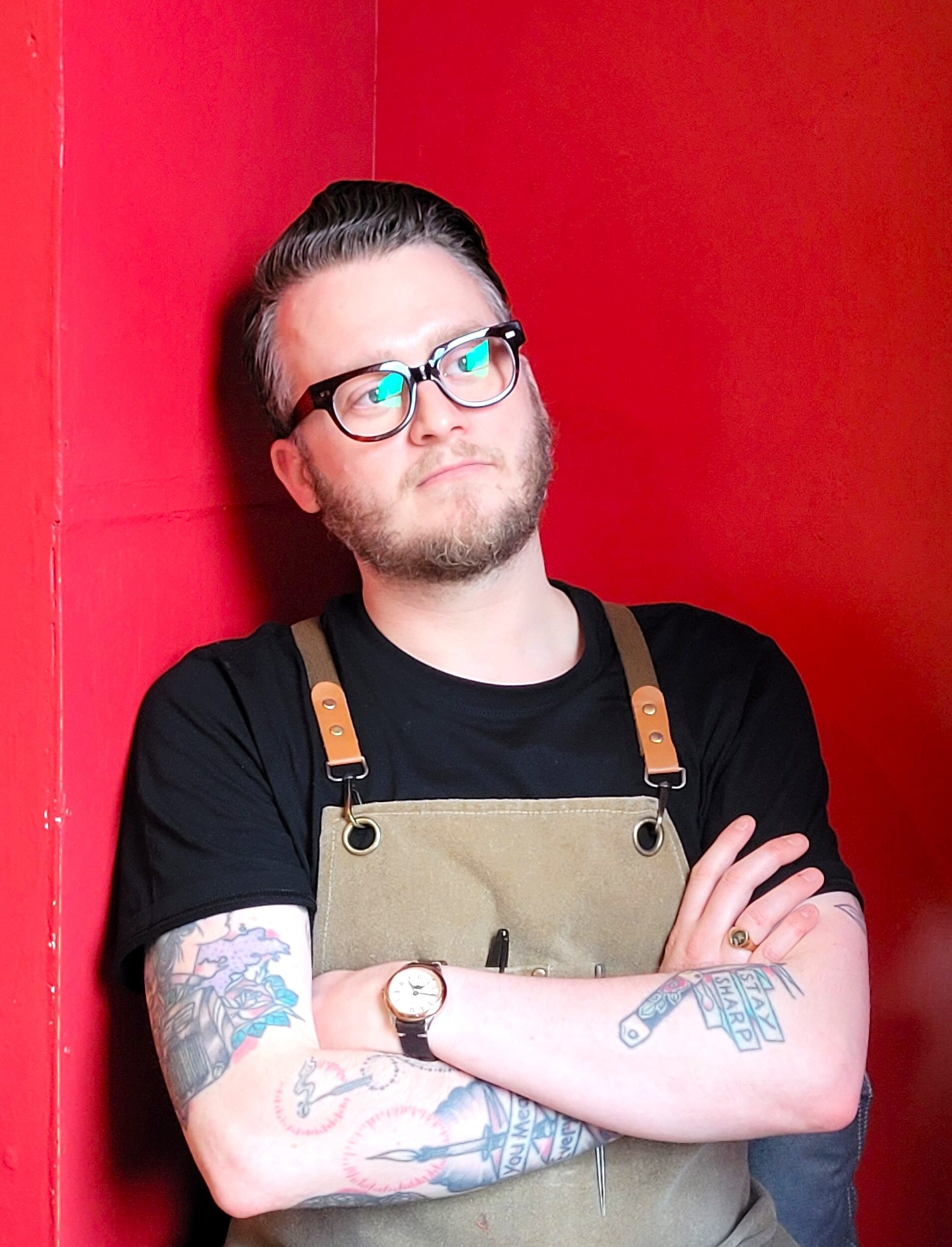Portrait of Euan in the cafe, gazing into the distance